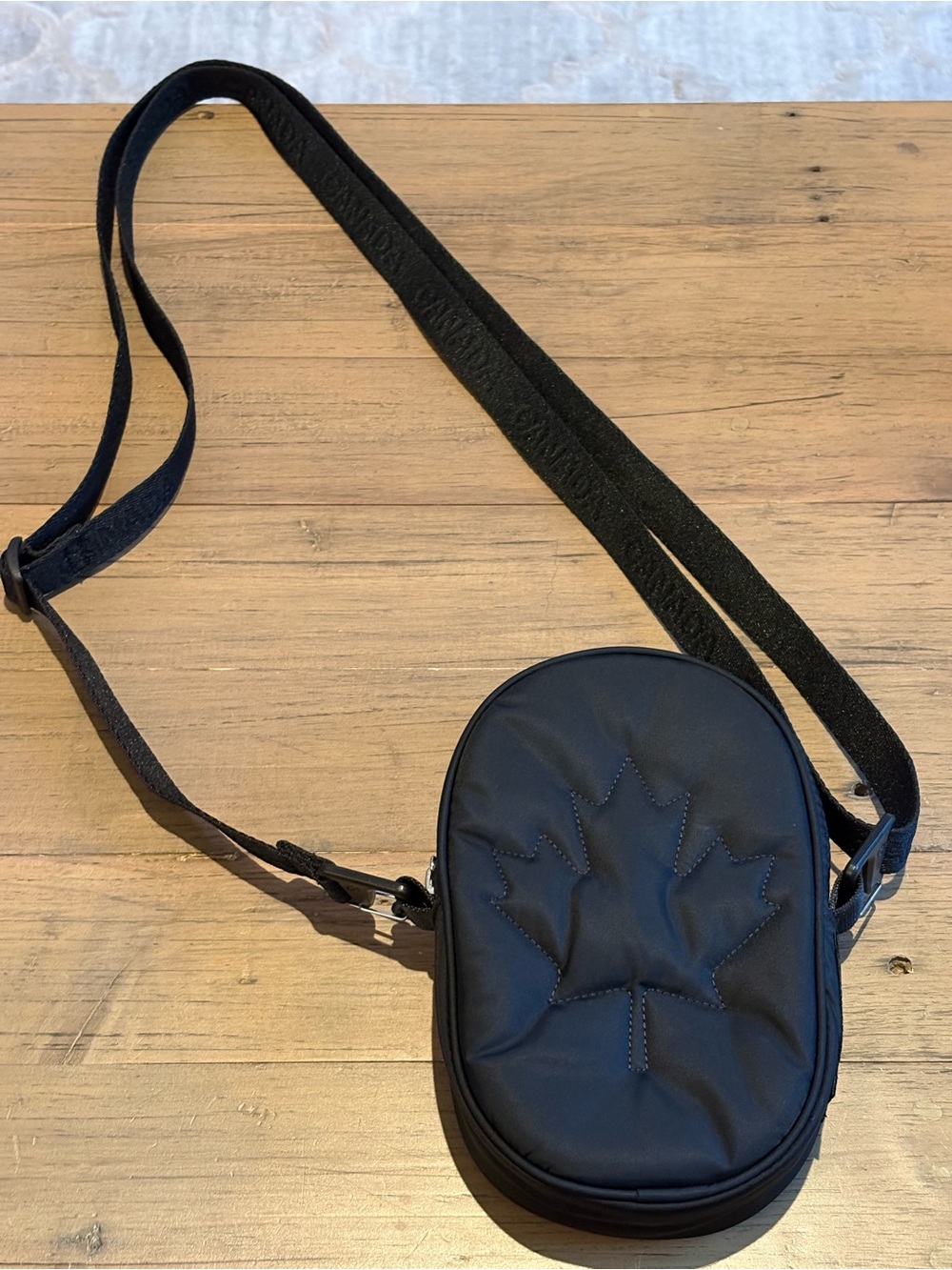 Lululemon Team Canada Black Crossbody Bag with Embossed Maple Leaf